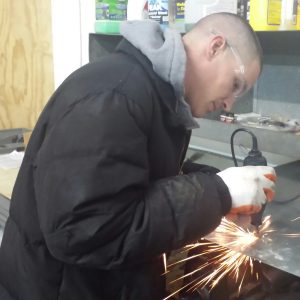 Josh Stafford, NLE Factory Trained Technician, makes a repair in the shop. His ability to think on his feet, as well as his vast knowledge from class work and on-the-job experience makes him a great person to have on your team!