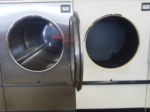 This pic just shows how much bigger the stainless baskets make a 75 lbs dryer look. Customers really believe that they are much bigger because of the mirror effect. 